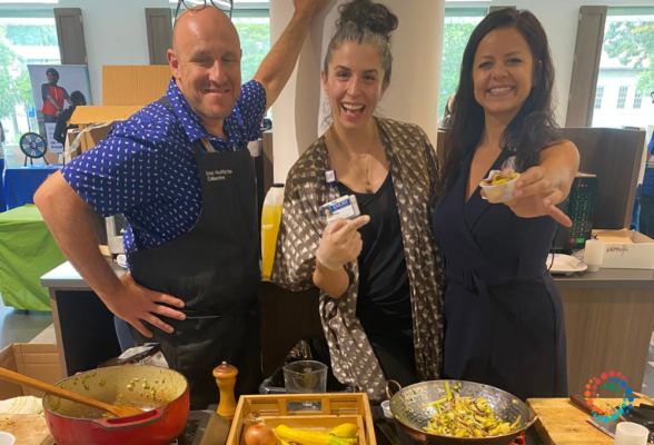 3 lifestyle medicine practitioners displaying the plant-based food options they have made for the hospital system they work for.