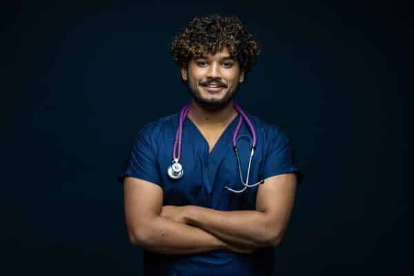 Cute,smiling,indian,doctor,or,surgeon,in,black,uniform,with