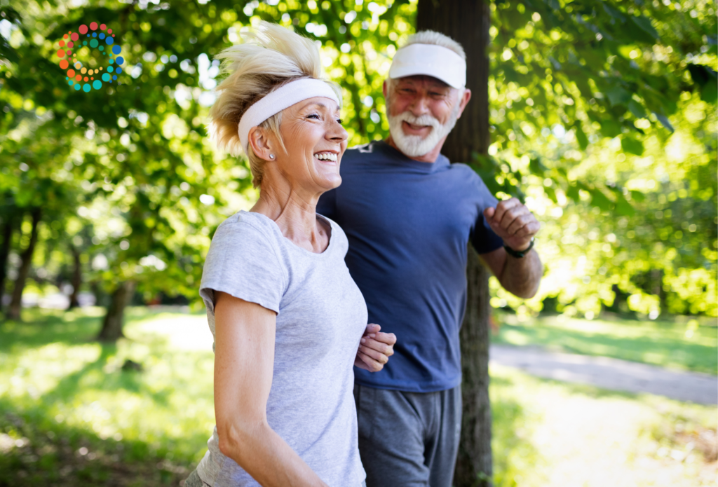 healthy older adults smiling and walking outside in the sunshine